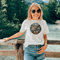The In My Element t-shirt features a striking circular graphic representing the four classical elements—Fire, Water, Wind, and Earth.